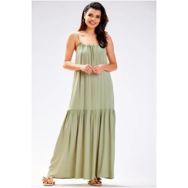 Bő, zöld színű ruha, hátán kivágással